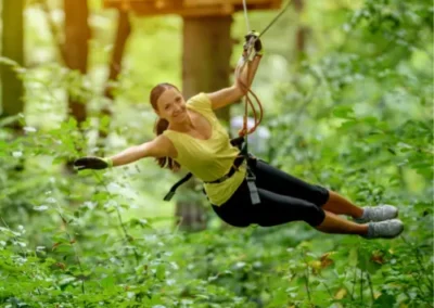 Lady using zipline in surrey forest